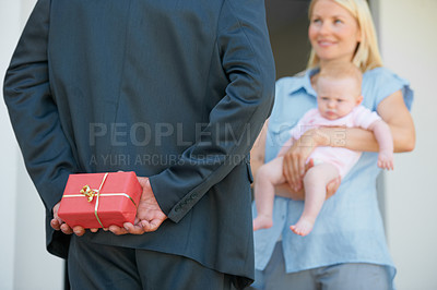 Buy stock photo Husband, wife and hiding gift box for surprise, look and happiness with baby, love and appreciation. Present, romance and good news for marriage, relationship and announcement with romantic partner
