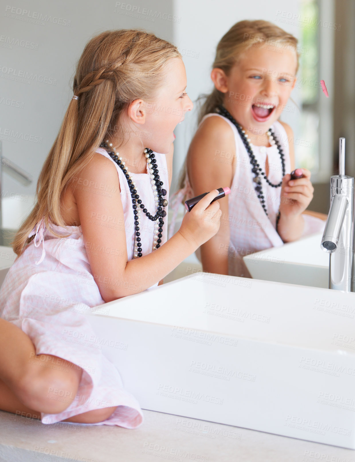 Buy stock photo Kid, lipstick and smile for mirror in bathroom with mark, writing or drawing with bad behavior. Little girl, happy and laugh for picture, naughty and problem with mom, makeup or cosmetics for beauty