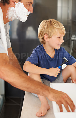 Buy stock photo Shaving, father and son with cream on face, smile and bonding in home with morning routine. Teaching, learning and dad with happy child with razor in bathroom for shave, cleaning or grooming together