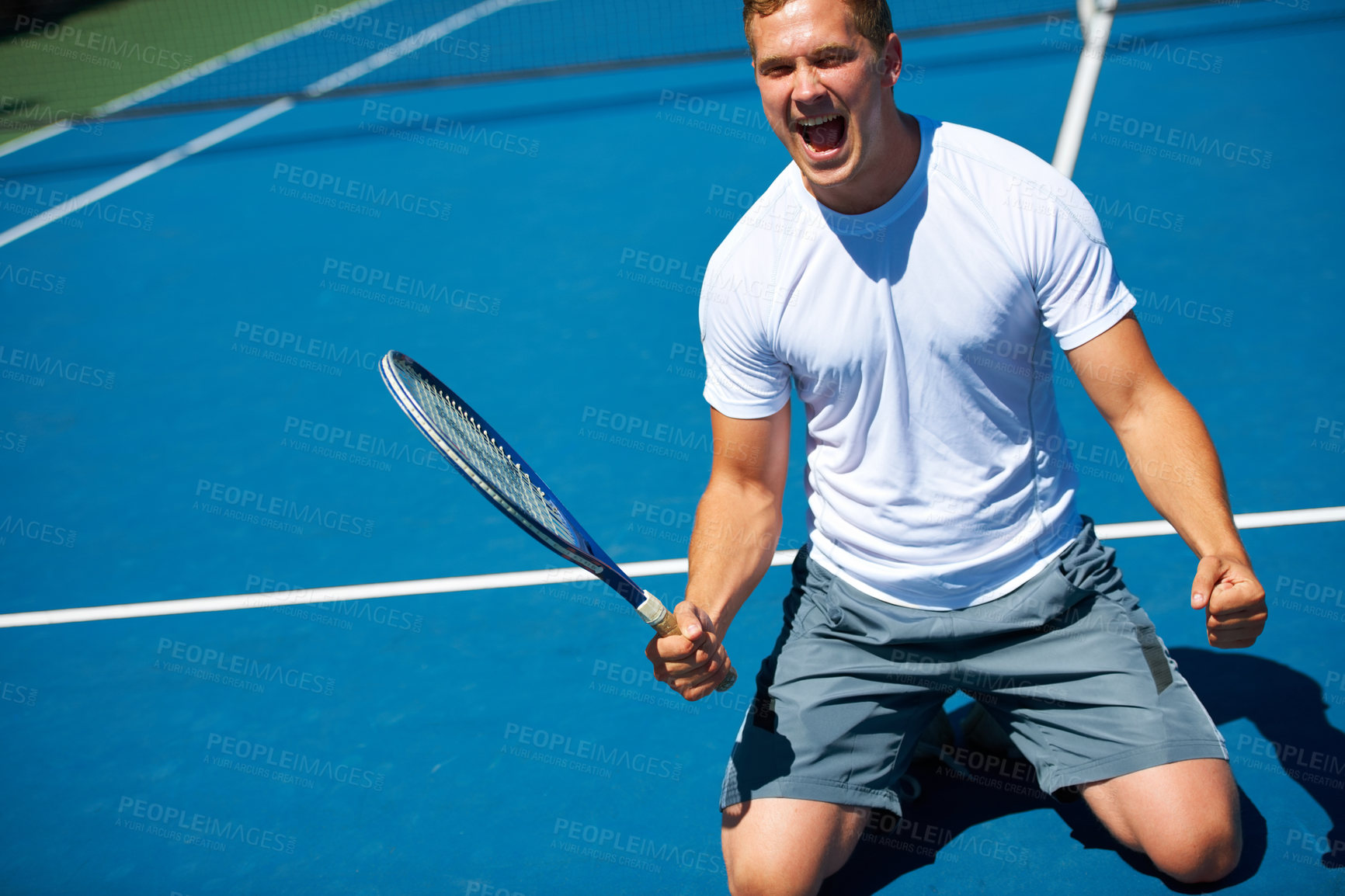 Buy stock photo Shot of a man celebrating victory in a tennis match