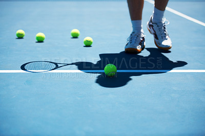 Buy stock photo Shot of a man unidentified man standing on a tennis court