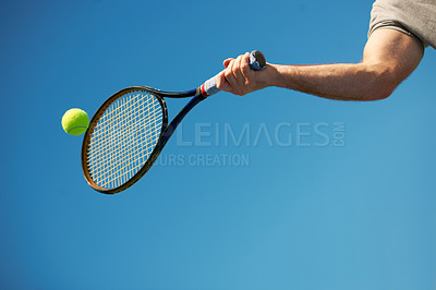 Buy stock photo Shot of a arm hitting a tennis ball with a racket