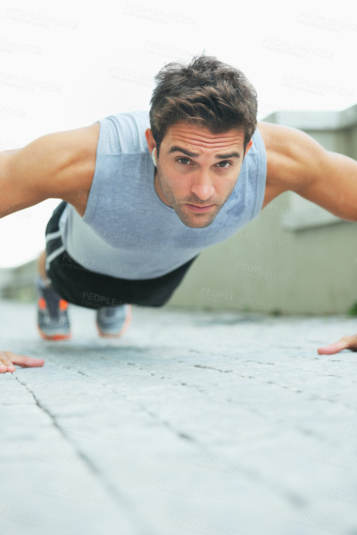 Buy stock photo Man, portrait and push ups in fitness for workout, exercise or outdoor training on floor. Muscular male person or athlete lifting body weight for strength, muscle or endurance in health and wellness