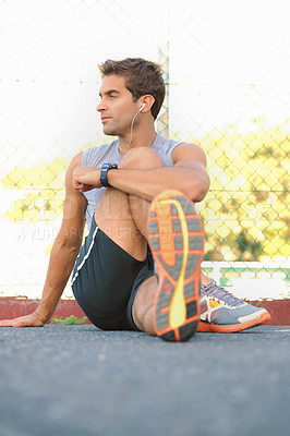 Buy stock photo Fitness, break and man athlete in nature with earphones training for race, marathon or competition. Sports, exercise and young male runner listening to podcast, radio or playlist for cardio workout.