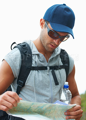 Buy stock photo Map, hiking and man with nature, adventure and fitness with fresh air, location information and journey. Person, hiker and guy with documents for guidance, direction and travel with forest and lost