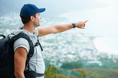 Buy stock photo Outdoor, hiking and man with nature, pointing and adventure with direction, journey and fitness. Person, hiker and guy with wellness, travel or location with fresh air, forest or landscape with view