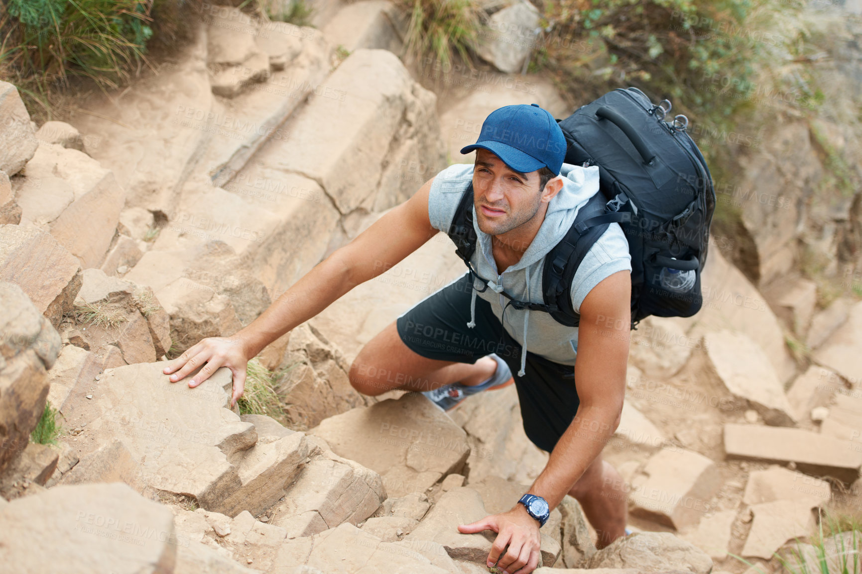 Buy stock photo Fitness, hiking and rock with man and climbing in nature for adventure, health and performance. Training, environment and explore with person on cliff of mountain terrain for backpacking and travel