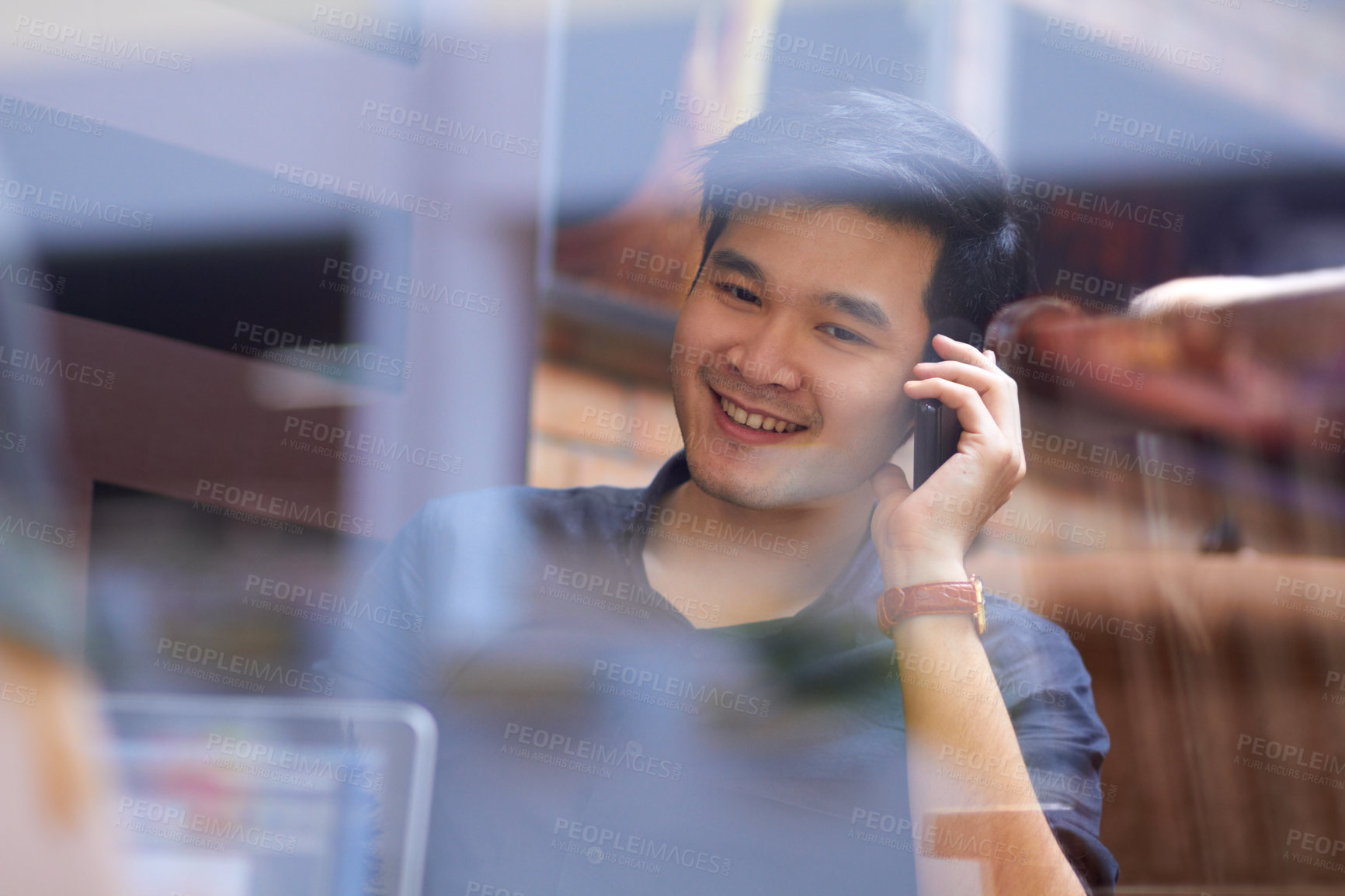 Buy stock photo Phone call, cafe window and Asian man in networking conversation with laptop, smile and online meeting. Happy tech consultant, startup and young businessman with cellphone, discussion and reflection