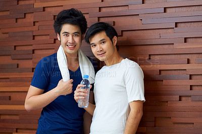 Buy stock photo Happy, portrait and gay couple at the gym with water on a break from a workout together. Smile, wellness and Asian lgbt men training at a club for exercise, health and happiness  with fitness