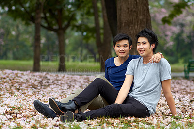 Buy stock photo Gay, Asian men and couple in park, nature date and life together with homosexual, pride and happiness. Young male people relax outdoor in Korea, LGBT and romance with trust in relationship and love