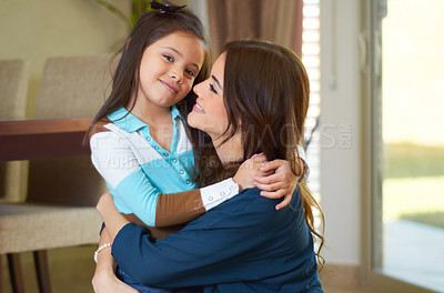 Buy stock photo Mom, child hug and portrait with a smile in family home with love, parent support and happiness. House, mama care and young girl with happy mother together in a living room bonding while hugging