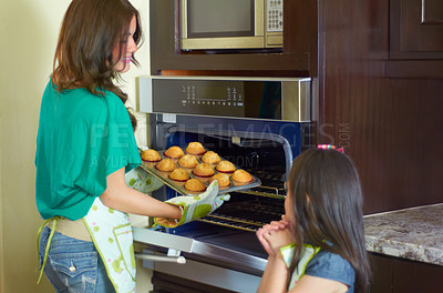 Buy stock photo Cute little girl baking with her nanny at home