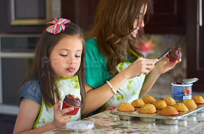 Buy stock photo Cute little girl baking with her nanny at home