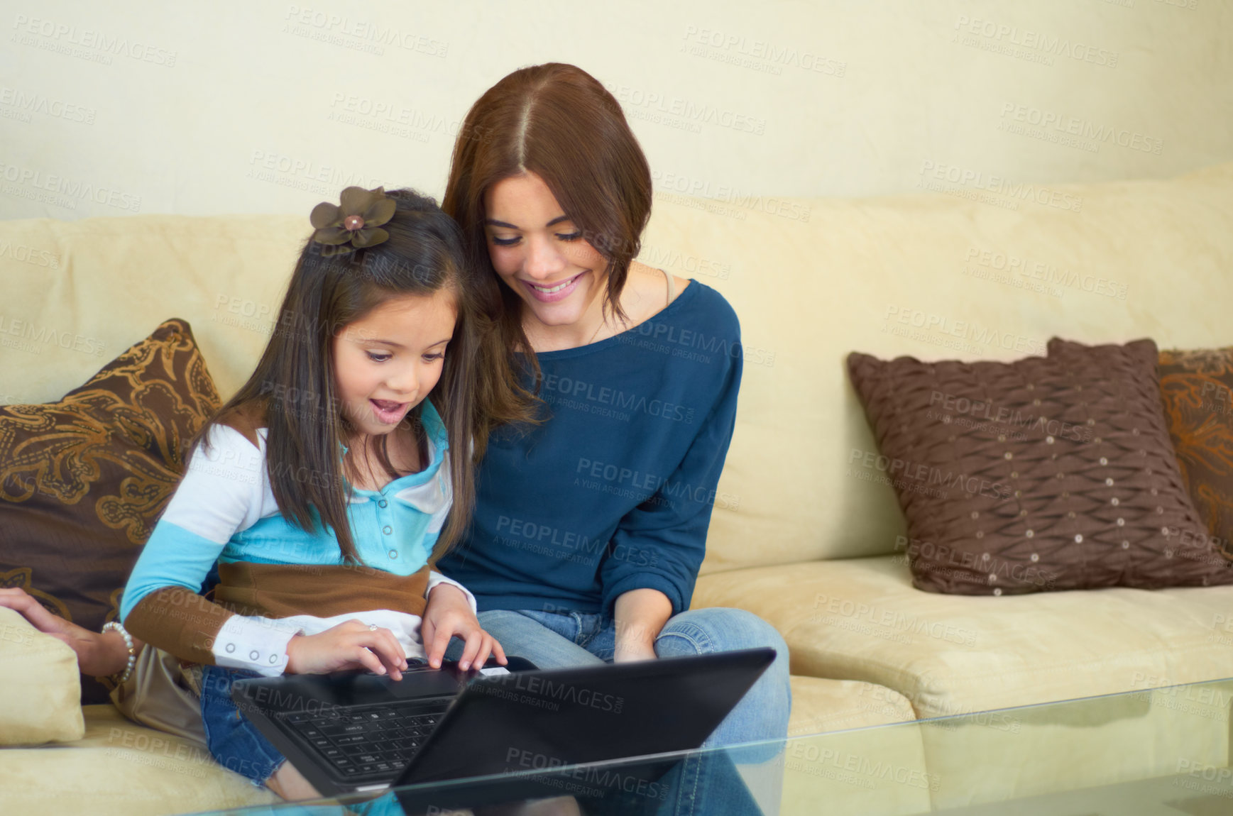 Buy stock photo Love, laptop and mother with her kid on a sofa browsing on social media while bonding together. Happy, smile and young mom on the internet with her girl child on computer in living room at their home