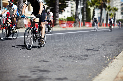 Buy stock photo A group of cyclers out on the road during a cycle tour