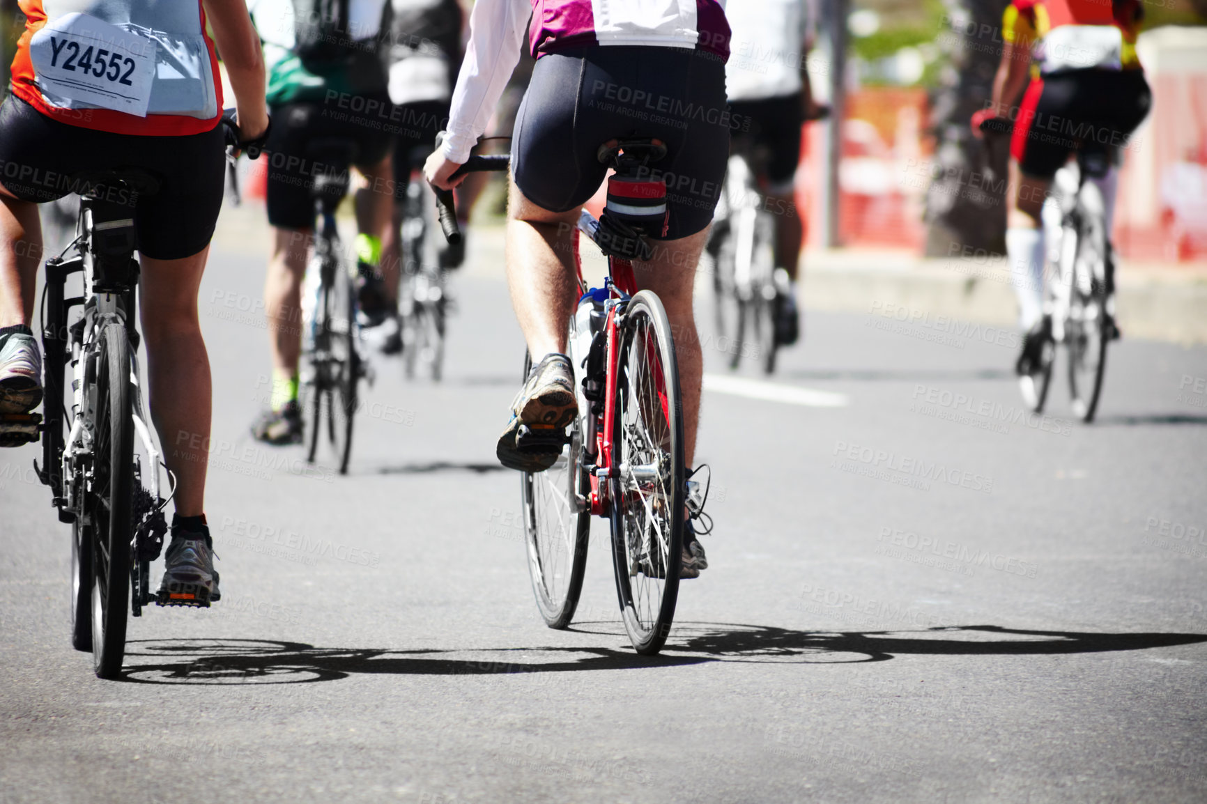 Buy stock photo A group of cyclers out on the road during a cycle tour