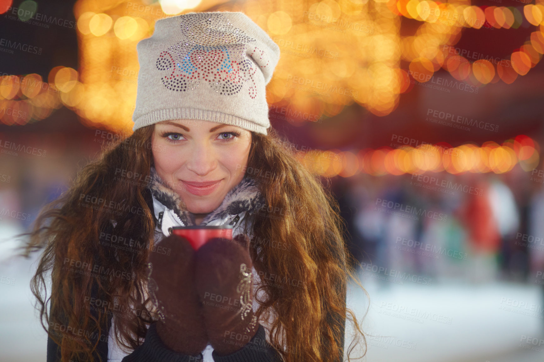 Buy stock photo Portrait of a beautiful young woman standing outside on a winter&#039;s day holding a cup of coffee