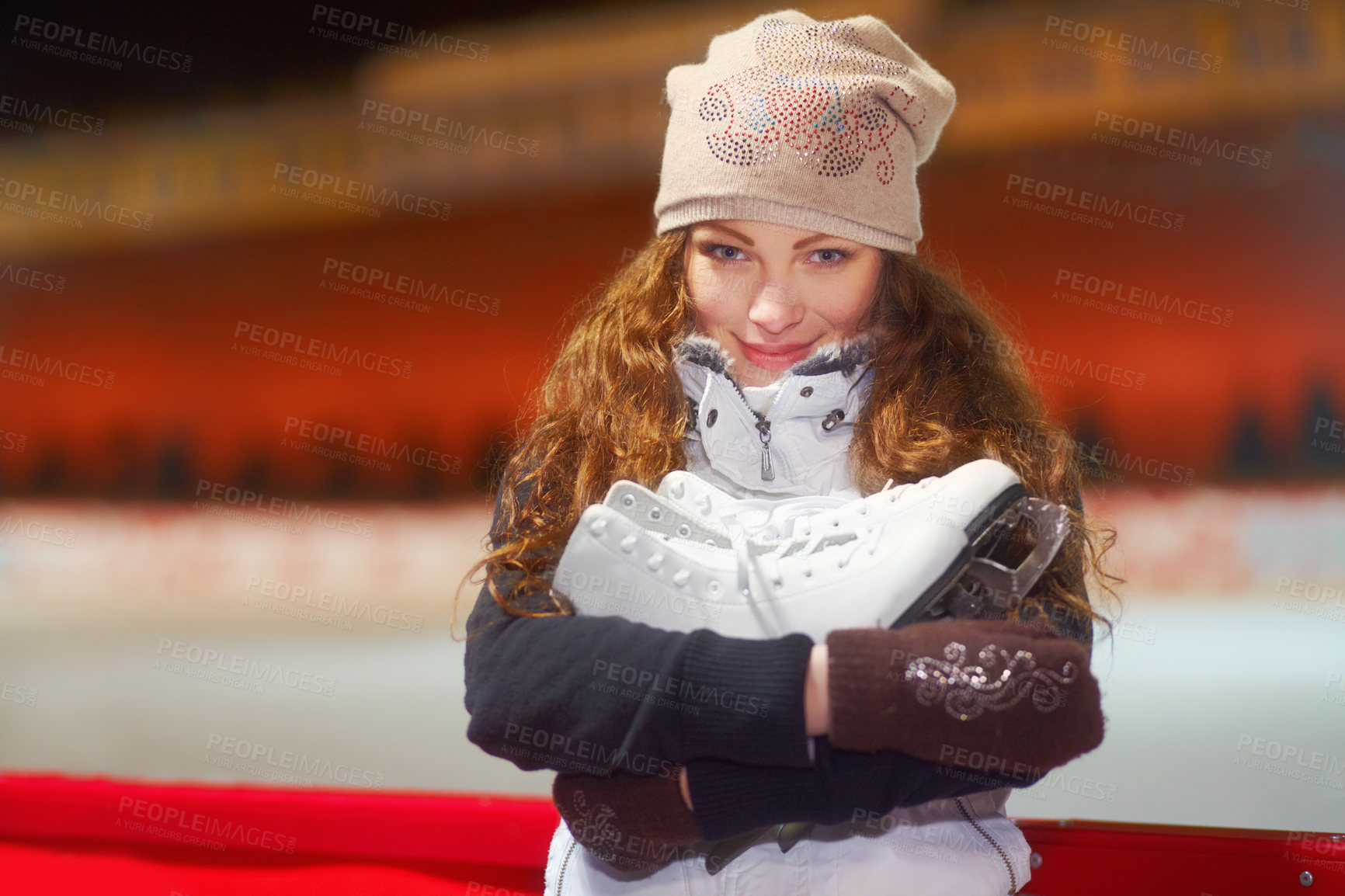 Buy stock photo Portrait of a beautiful young woman standing in an ice skating rink