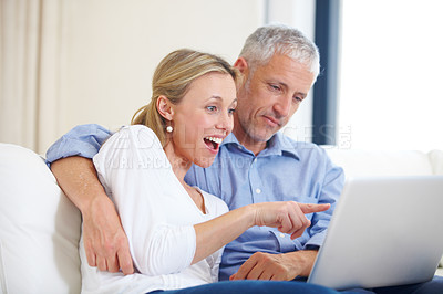 Buy stock photo Mature couple, laptop and video call with conversation, smile and living room couch. Social media, technology and communication in lounge, husband and wife with connection, streaming and happy
