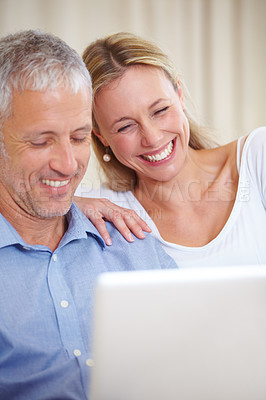 Buy stock photo Mature couple, laptop and video call with laugh, conversation and living room couch. Social media, technology and communication with family, man and woman with connection, streaming and happy
