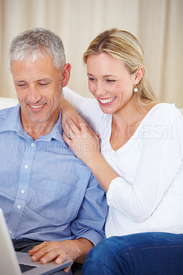 Buy stock photo Married couple, laptop and video call with embrace, conversation and living room couch. Social media, technology and communication with family, man and woman with connection, streaming and happy

