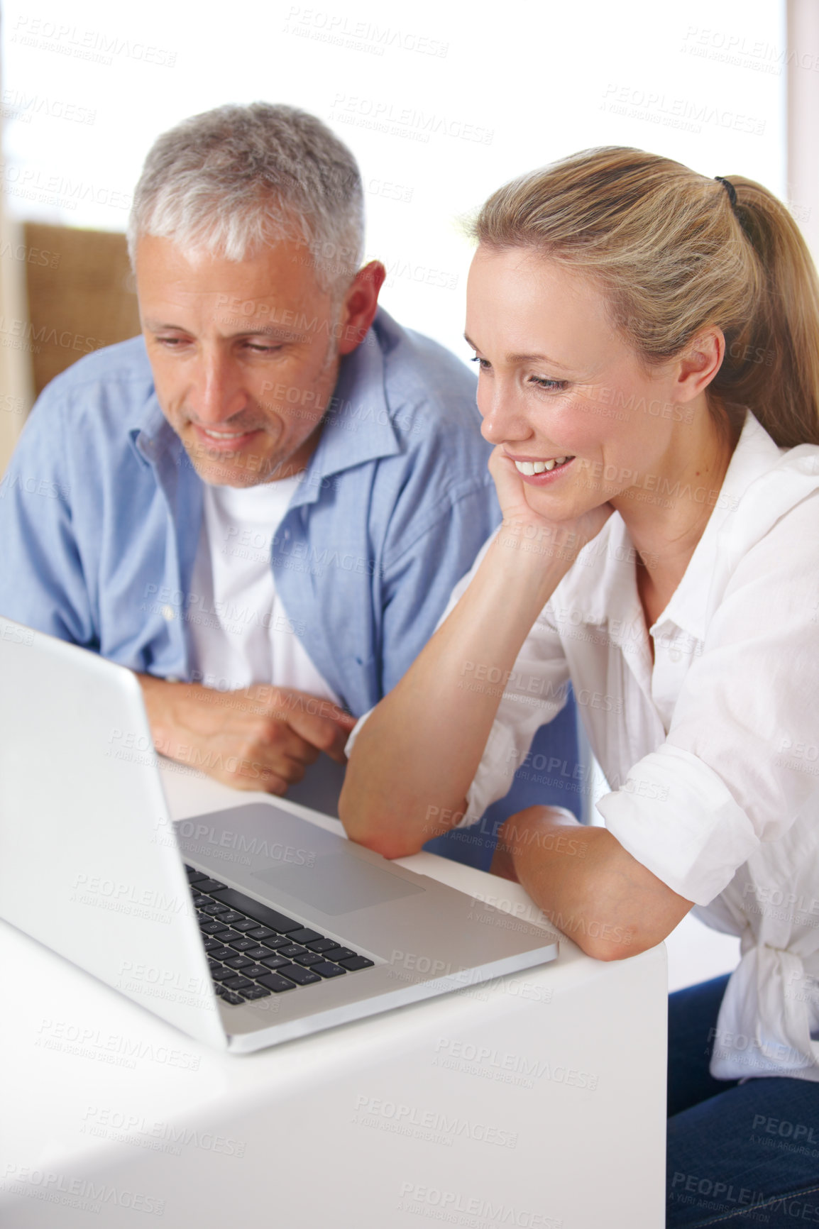 Buy stock photo Mature couple, laptop and video call with conversation, smile and kitchen counter. Social media, technology and communication in lounge, husband and wife with connection, streaming and happy