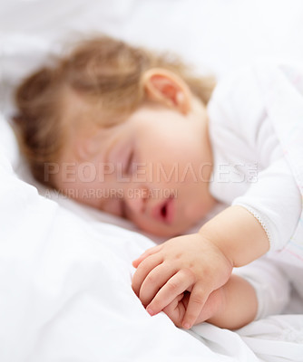 Buy stock photo Hands, baby and kid sleeping on bed for calm break, peace and dreaming to relax at home. Tired, young child and cozy nap for newborn development, healthy childhood growth and rest in nursery room