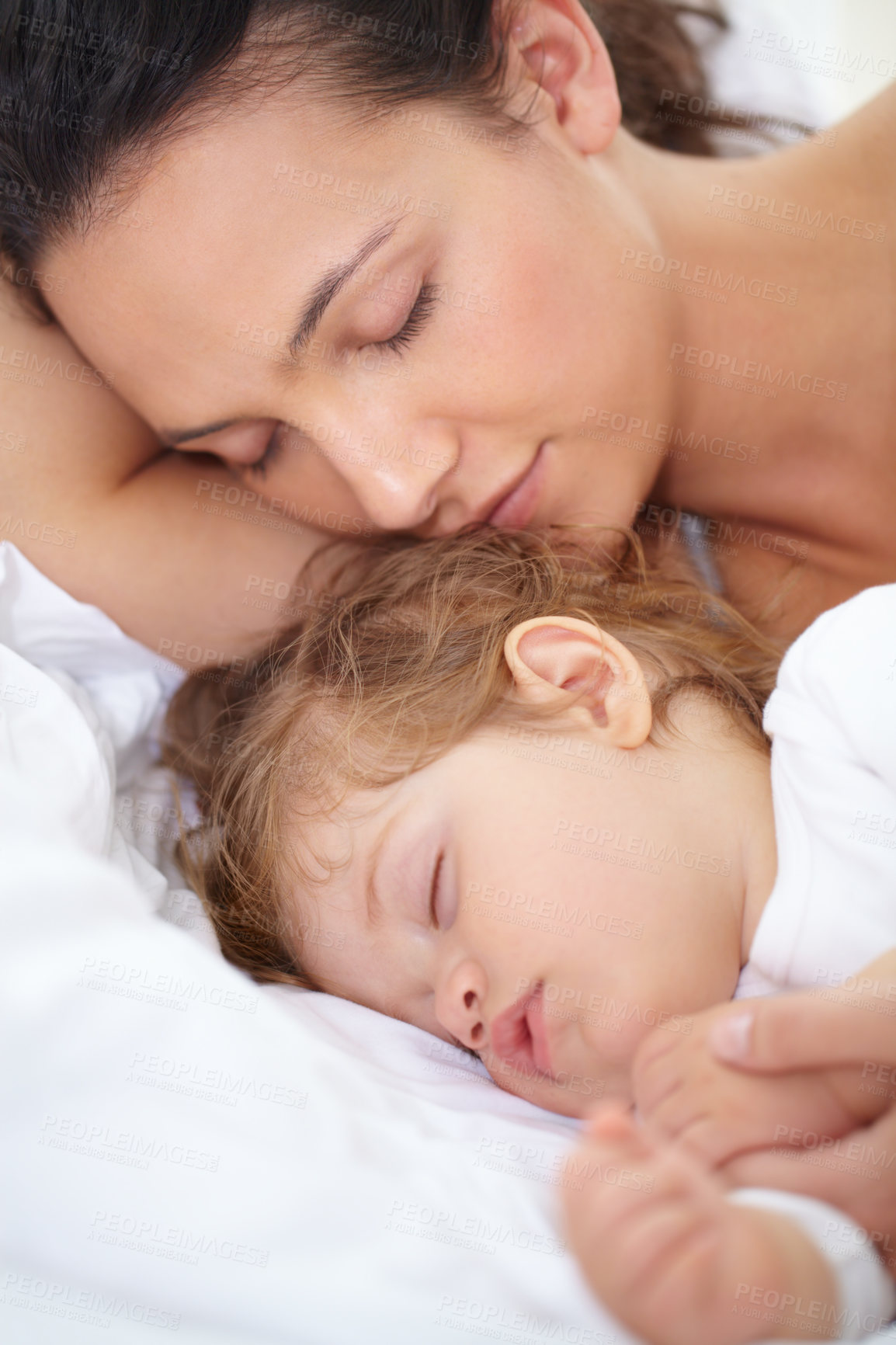 Buy stock photo Mom, baby and kid sleeping on bed together for calm break, peace or dreaming to relax at home. Face of tired mother, young child and cozy nap for newborn development, healthy childhood growth or rest