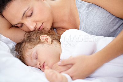 Buy stock photo A mother and daughter sleeping on the bed