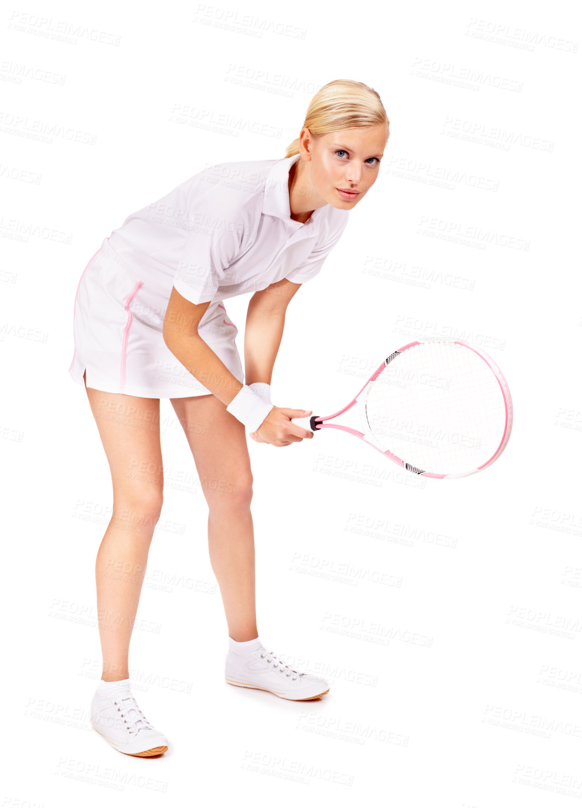 Buy stock photo Full body portrait of an attractive young woman getting ready to return the serve
