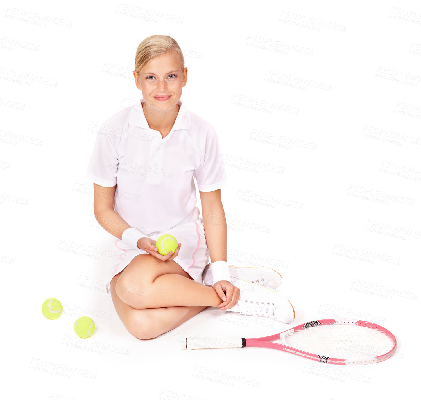 Buy stock photo Portrait, woman and sitting with tennis balls, racket and skill for sports, competition and break in studio on white background. Happy professional athlete on floor with bat for performance for match