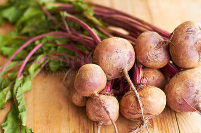 Buy stock photo Closeup shot a bunch of radishes on a cutting board