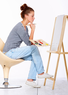 Buy stock photo Woman, painting and thinking about art canvas in studio for creativity and talent with paint brush for color. Female artist or painter isolated on a white background for creative work and ideas