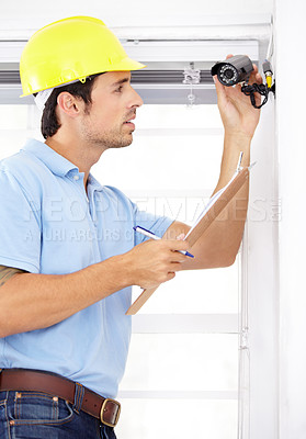 Buy stock photo Technician man, clipboard and security camera for home CCTV installation and documents for safety or maintenance. Engineering contractor with checklist for surveillance, inspection and services