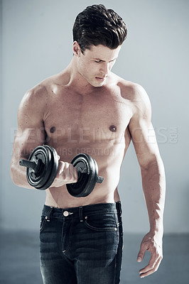 Buy stock photo Fitness, muscular and man with dumbbell weight in a studio for bodybuilding workout, exercise or training. Sports, health and young male athlete from Canada with equipment isolated by gray background