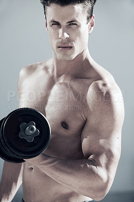 Buy stock photo Portrait, muscles and man with dumbbell weight in studio for bodybuilding workout, exercise or training. Sports, fitness and young male athlete from Canada with equipment isolated by gray background.