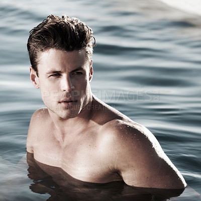 Buy stock photo A handsome male model in water looking to the side