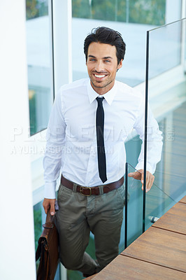 Buy stock photo Happy, corporate and professional with a business man on stairs in a modern at work for progress. Smile, staircase and promotion with a handsome young male employee walking into his workplace