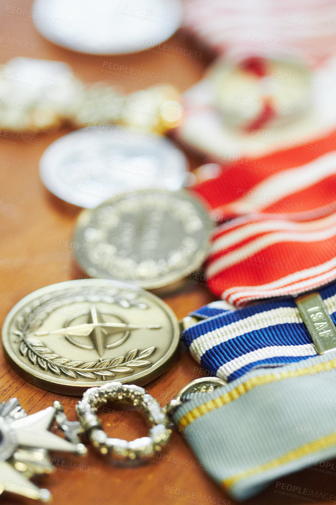Buy stock photo Closeup shot of war medals lying on a table