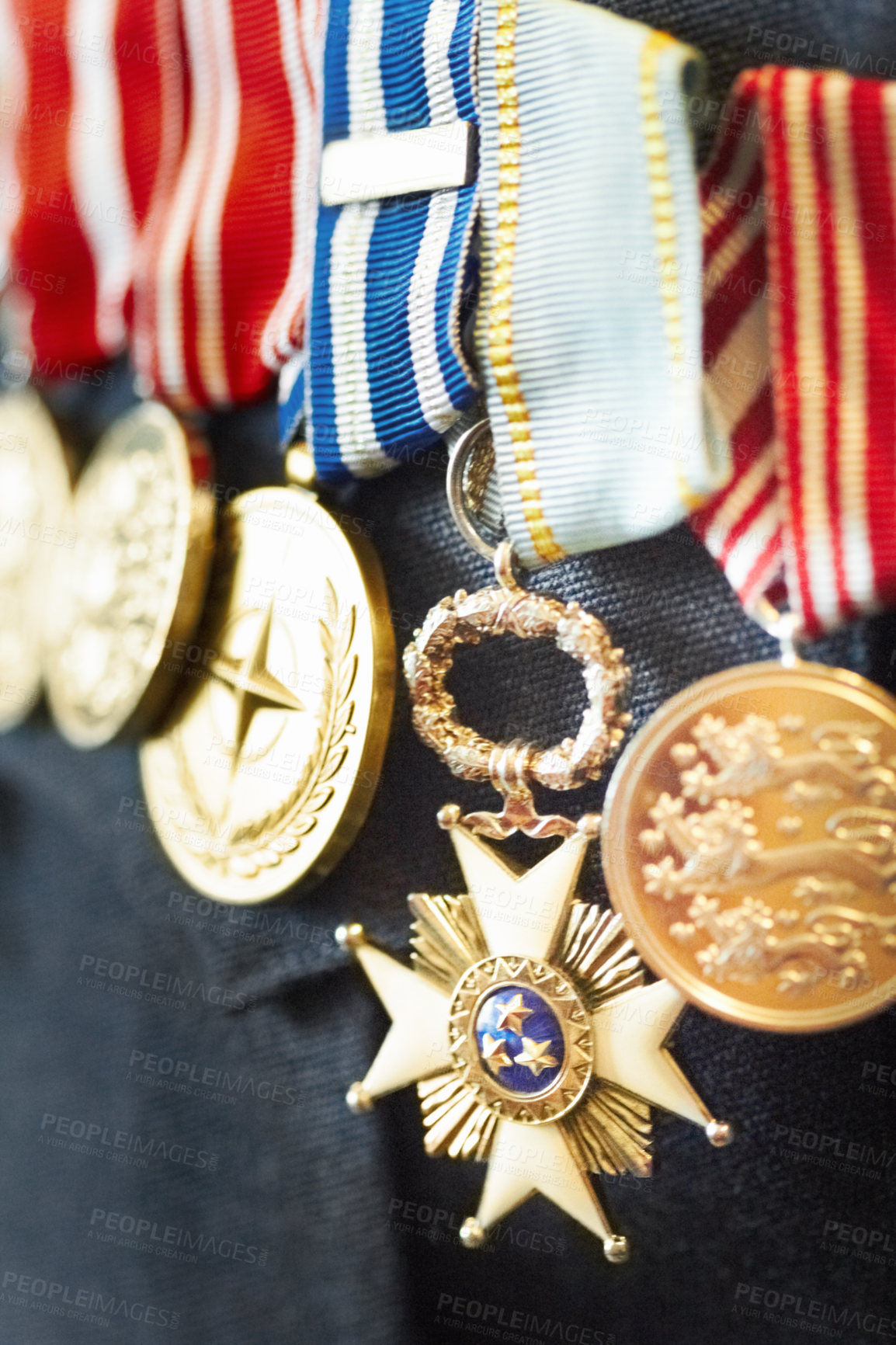 Buy stock photo Cropped shot of war medals on a solider's suit