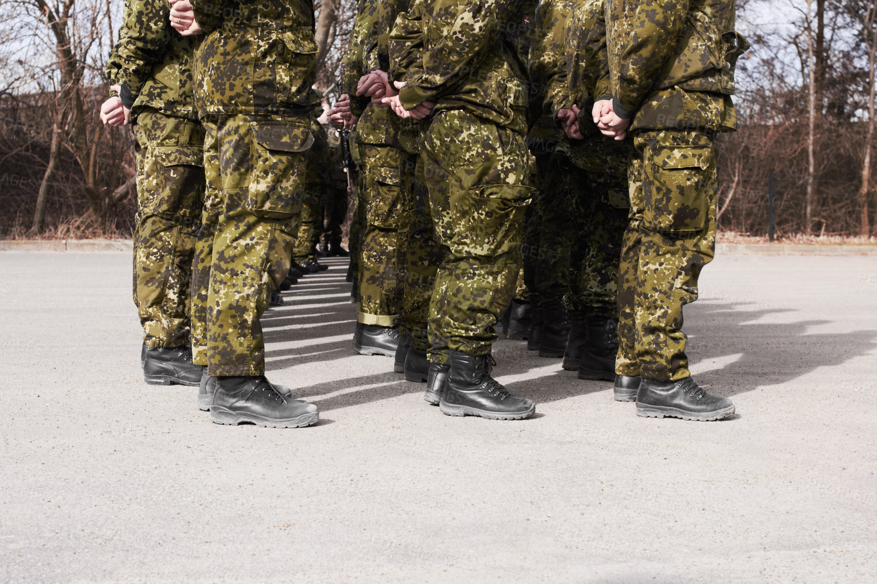 Buy stock photo Army, military and group of soldiers training together outdoor for war, service or mission. Feet of men or team in formation for exercise, safety and security in camouflage uniform as defence