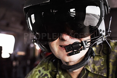 Buy stock photo Military, pilot and mature man in a helicopter with microphone for communication, location and navigation. Army, airplane and face of male professional aircraft flyer with gear and flight helmet