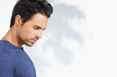 Buy stock photo Thinking, sad and man profile by a white wall outdoor in the sun with freedom and ideas. Relax, peace and male person with mockup and summer with vitamin D, leaning and contemplating with outfit