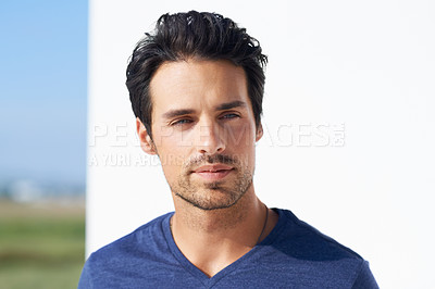 Buy stock photo Portrait of a handsome young man standing outside