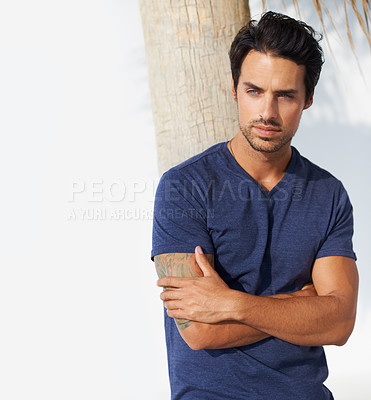 Buy stock photo Thinking, fashion and calm man by an outdoor tree in the sun with male model and ideas. Relax, peace and person with arms crossed and summer with tree, leaning and vacation with casual outfit