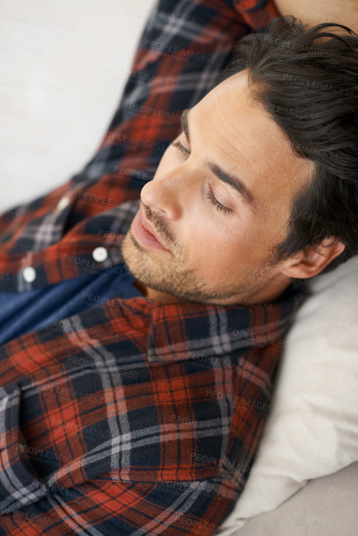 Buy stock photo Relax, sleeping and man on sofa in home for afternoon nap, resting and calm in living room. Asleep, eyes closed and face closeup of tired person on couch lying for fatigue, comfortable and wellness