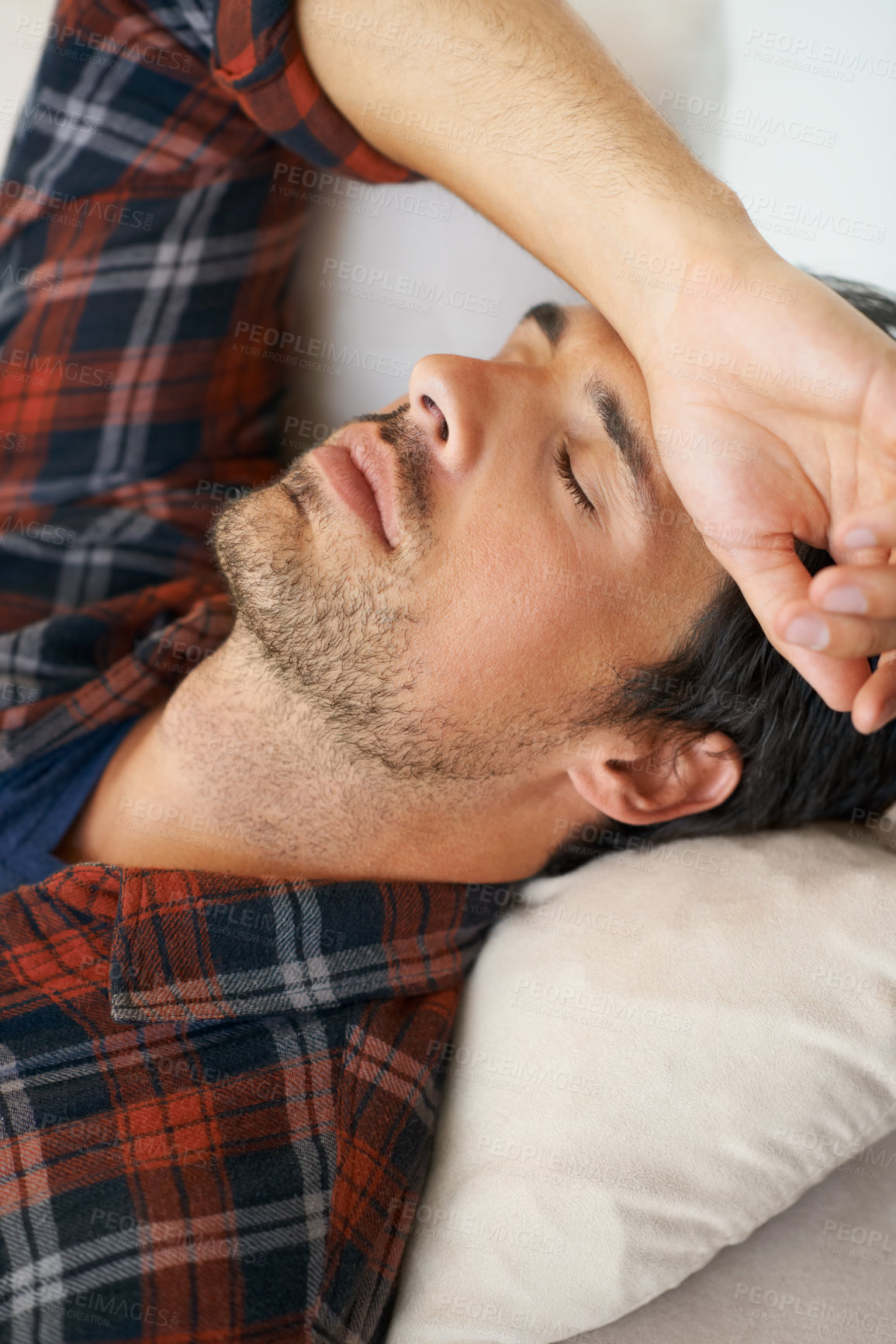 Buy stock photo Rest, sleeping and man on sofa in home for afternoon nap, relax and calm in living room. Asleep, eyes closed and face closeup of tired person on couch lying for fatigue, comfortable and wellness