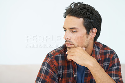 Buy stock photo Man, thinking and serious or hands for question, idea and contemplating in living room of apartment or home. Person, face and mental health or thoughtful on couch in lounge for anxiety on weekend