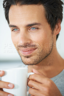 Buy stock photo Relax, face and happy man with coffee break in a house with me time, peace or weekend freedom at home. Smile, chilling and male person with tea in a. living room for a calm moment of reflection