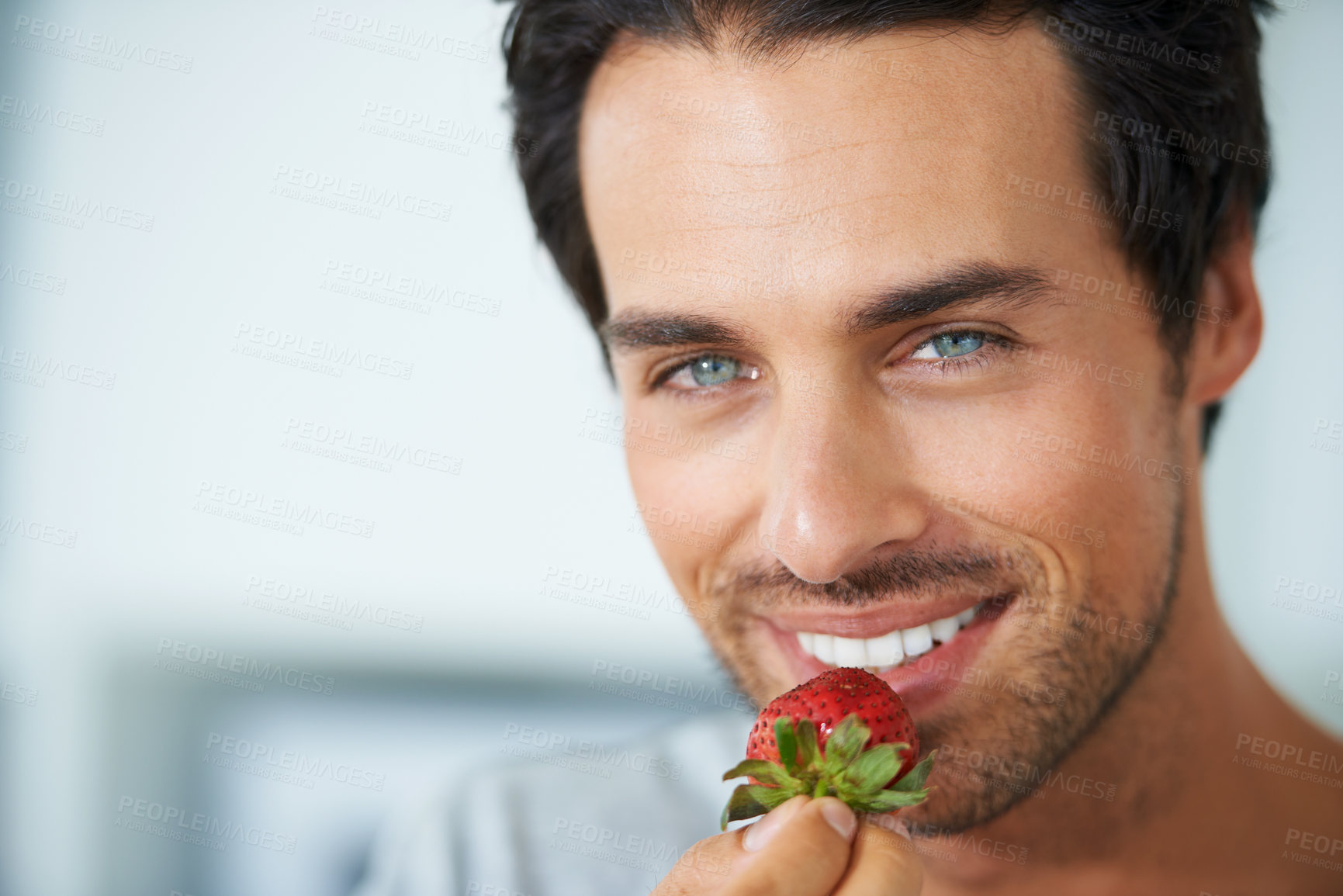 Buy stock photo Home portrait, happy man and eating strawberry for morning diet, healthy lifestyle or fruit benefits, wellness or breakfast. Natural detox, nutrition food and face of person smile for antioxidants
